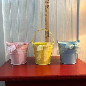 Lot of three pastel pails with delicate ribbon for Easter or spring decorating
